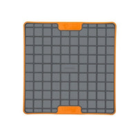 A orange square hard case rubber mat with squares inside.