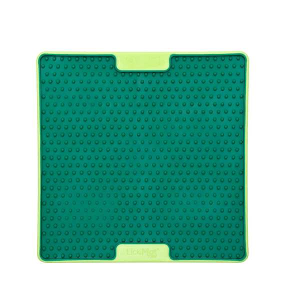 A green square hard case rubber mat with small numbs inside.