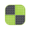 A green square hard case mat with numbs and squares inside.