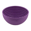 A purple rubber bowl with small nubs inside.